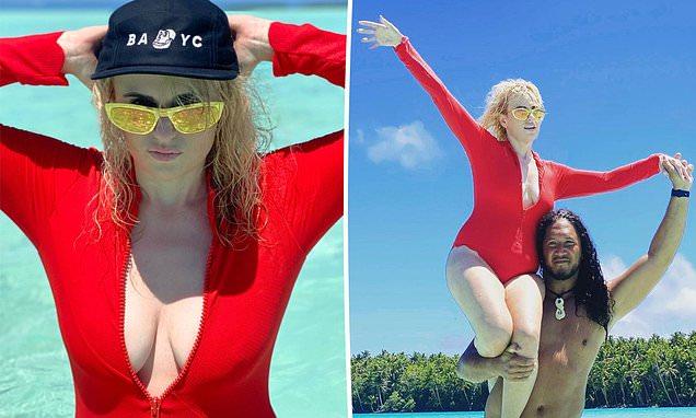 Rebel Wilson flaunts her epic 30kg weight loss in a plunging red swimsuit | Daily Mail Online